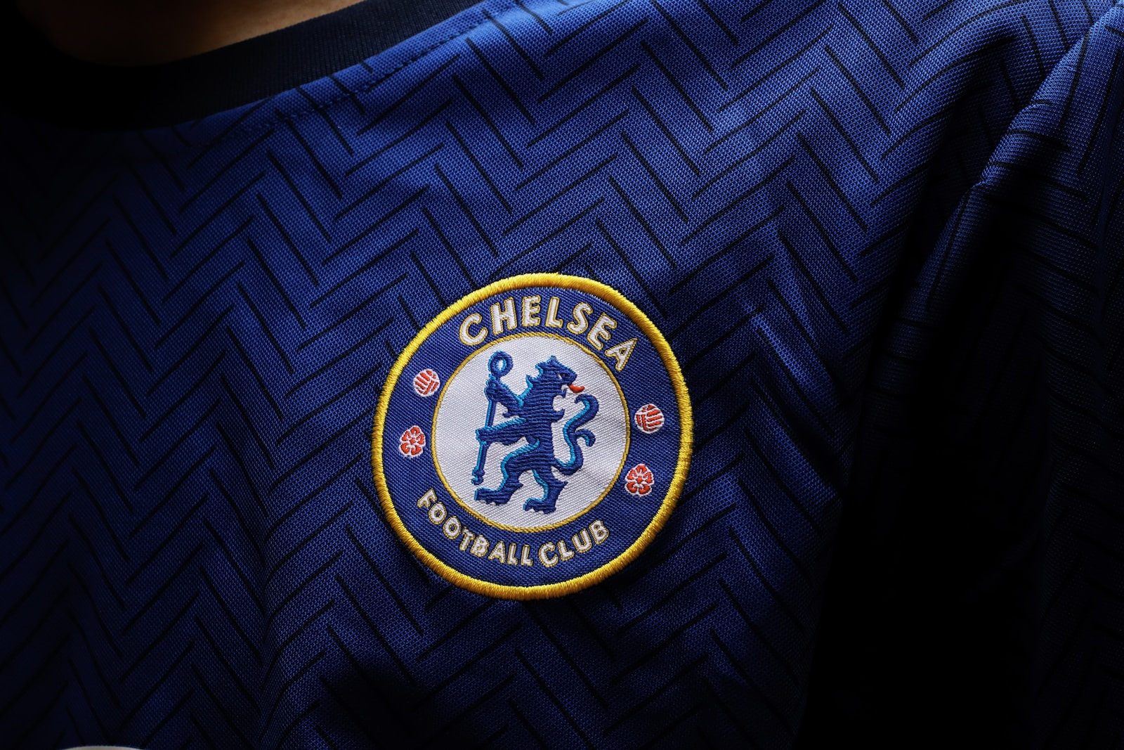 a close up of the chelsea badge on a shirt